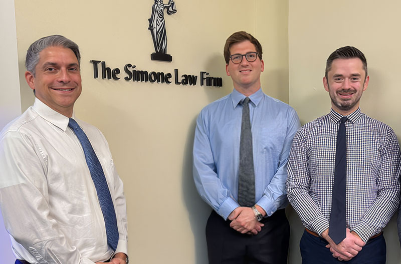 Group photo of The Simone Law Firm team